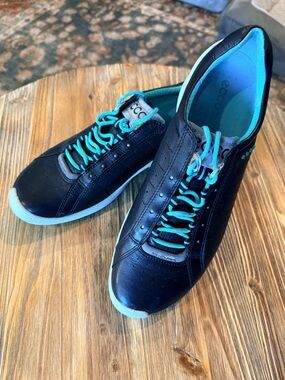 Ladies Ecco Black Leather Casual Sneakers/Golf Shoes with Teal Accents.
